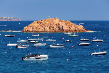 Fishing boats and pleasure boats in the bay of Tossa de Mar, Catalonia, Spain