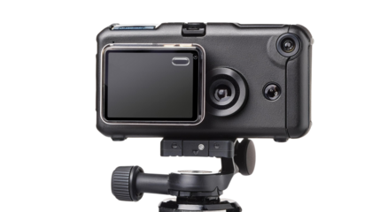 A handheld action camera mounted on a stabilizer for video recording, set against a transparent background.