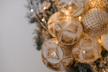 Elegant Gold Christmas Ornaments Adorning a Tree Branch