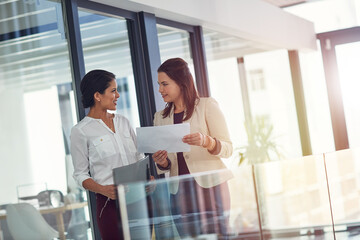 Meeting, office and business women with documents for discussion, consulting and conversation for...