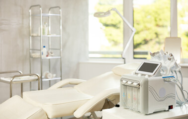 Professional office of aesthetic medicine clinic with treatment chair for patients and modern...