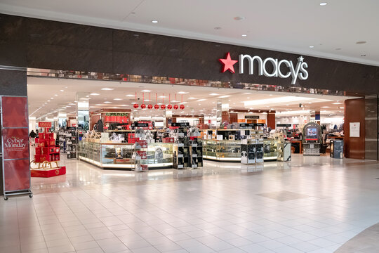 Macy's deaprtment store sign with red star in shopping mall.