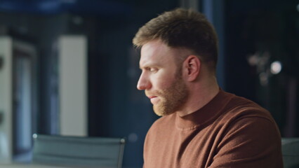 Obraz premium Professional accountant reviewing documents at office desk closeup. Smiling man