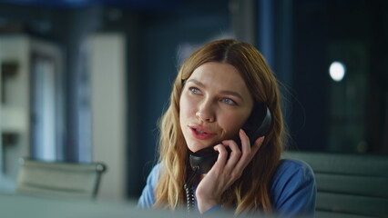 Obraz premium Business manager answering telephone sitting workspace closeup. Help desk worker