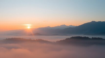 Obraz premium Serene sunrise over a misty mountain range
