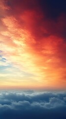 Obraz premium A breathtaking sunset over clouds, showcasing vibrant colors and serene atmosphere.