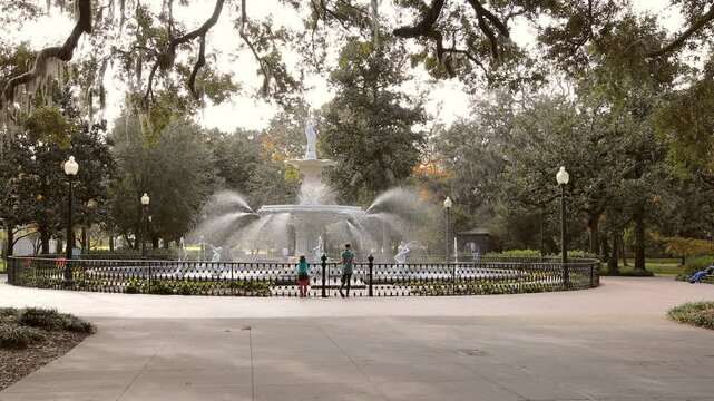 Two children at the fountain in Forsyth Park, Savannah, Georgia, USA