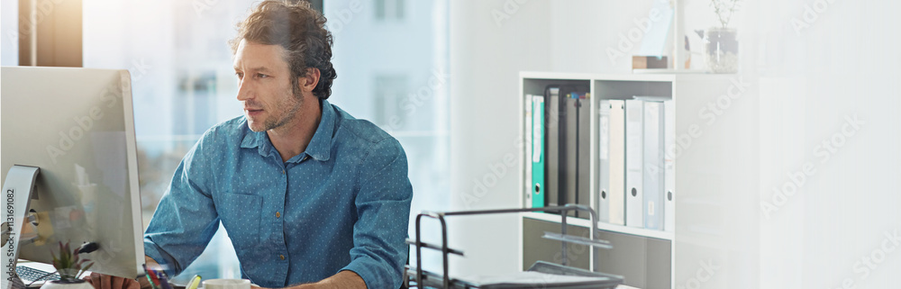 Poster Computer, typing and web development with business man at desk in office for planning or research. Banner, mockup and space with confident employee in workplace for online review of information