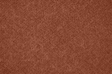 Fototapeta premium Mocha Mousse toned colour monochrome texture knitted fabric. Knitted Jersey as textile background. Monochrome color background. Wool knitting texture. Trendy color 2025.