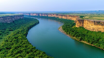 Serene River Winding Through Lush Green Landscape and Cliffs