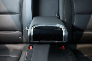 Vehicle armrest with cup holder, beige design, for luxury cars