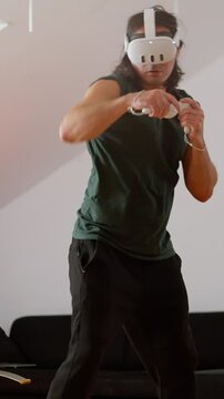 A person practices virtual boxing in a VR helmet. Slow motion 4k footage