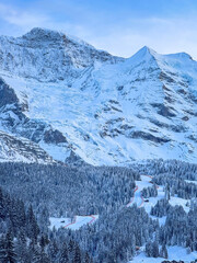 Scenic view of snowcovered Jungfrau (left) and Silberhorn mountain above Lauberhorn ski racing...