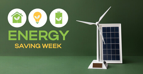 Wind turbine model and solar panel on green background