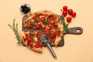 Composition with tasty pizza and cutter on beige background