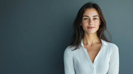 Obraz premium Studio portrait of a confident woman standing in front of a plain background
