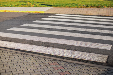 Fototapeta premium Pedestrian crossing on an asphalt road, solution to the situation