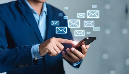 Person uses a smartphone with floating email icons, communication concept.