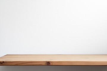 Naklejka premium Minimalist wooden shelf against a plain wall.