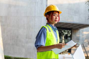portrait of a woman engineer in construction site