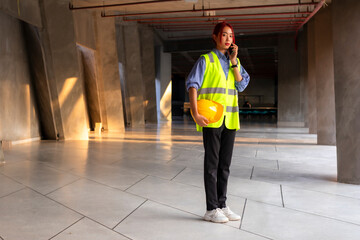 woman engineer with phone on site