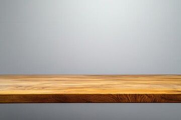 Fototapeta premium Wooden table surface with a minimalistic background.