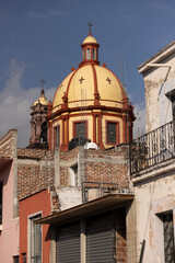 Fototapeta premium Jiquilpan, Michoacán, Mexico- December 24, 2023: Afternoon light shines on a historic cathedral in the historic central area.