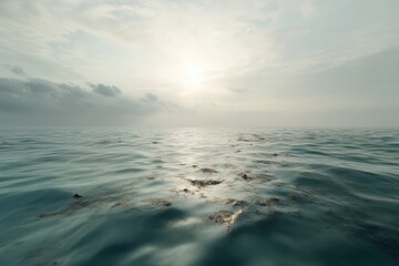 Obraz premium Serene Horizon Over Calm Water at Dusk with Gentle Waves Reflecting Soft Sunlight and Overcast Clouds in a Peaceful Coastal Scene