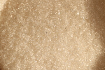 Closeup of granulated brown sugar, highlighting its fine texture and unique qualities