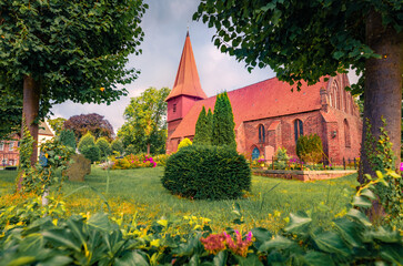 Summer view of red bricks St. Nikolai Evangelical church. Nice morning cityscape of Altefahr...