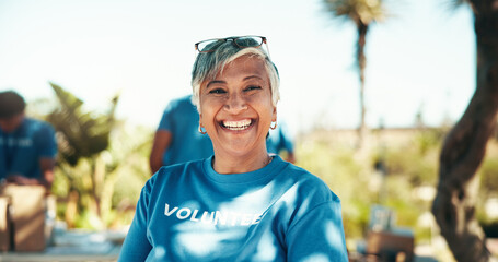 Charity, portrait and smile of woman volunteer outdoor in park for community food drive or...