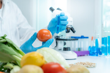 Scientist check chemical food residues in laboratory. Control experts inspect quality of fruits,...
