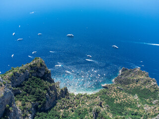 Aerial view of Capri from Monte Solaro, captured by drone. The azure Mediterranean, luxury yachts,...