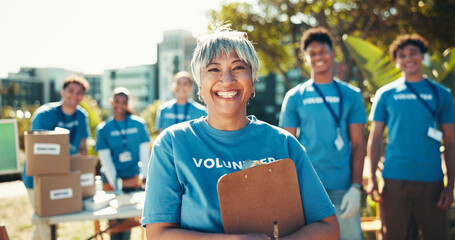 Activism, portrait and smile of woman volunteer outdoor in park for community food drive or...