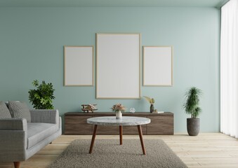 Living room with picture frame There is a sofa on the floor decorated with beautiful plants.