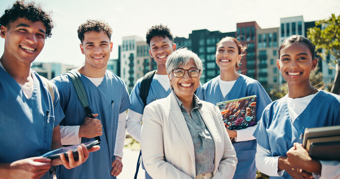Medical student, portrait and professor with people in outdoor for college, healthcare and teacher. Scholarship, university and doctors with intern group on hospital campus for smile and education
