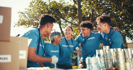 Charity, laughing and teamwork with volunteer group outdoor in park for community food drive or...