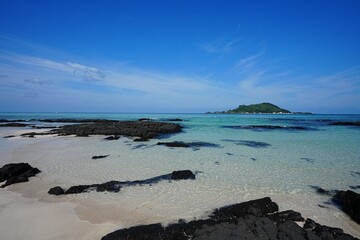 sparkling ripples and far island