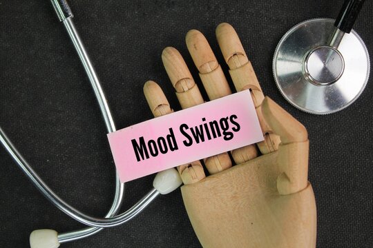 stereoscope and colored paper with the words mood swings. sudden and unaccountable mood swings. Menopause concept 