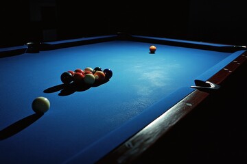 Dramatic artistic shot of a pool table with colorful balls in a dimly lit room capturing the essence of game night atmosphere and player strategy