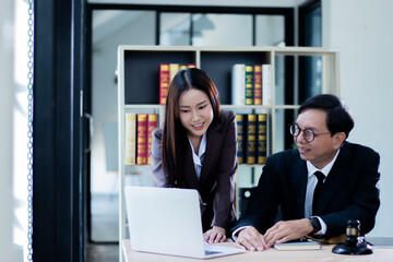 Asian judge and holding a gavel close-up