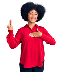 Young african american girl wearing casual clothes smiling swearing with hand on chest and fingers...