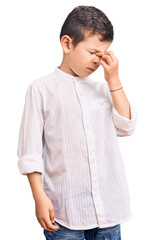 Cute blond kid wearing elegant shirt tired rubbing nose and eyes feeling fatigue and headache....