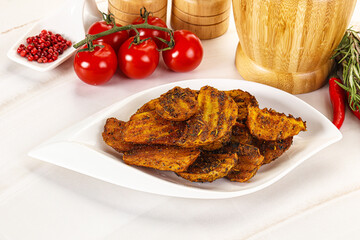 Golden baked potato Idaho with spices