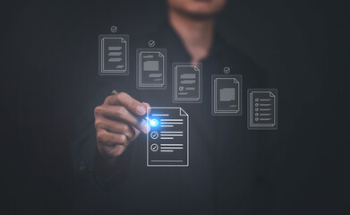 Business documents using a computer and digital technology to store data for the study, financial...