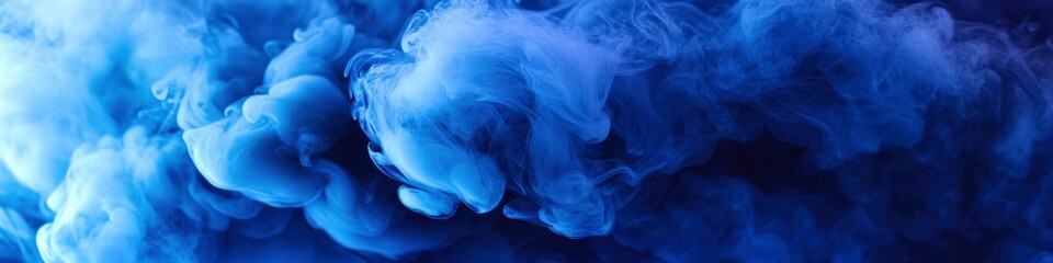 Fototapeta premium Abstract blue smoke background. Blue-colored fluid ink in water, fluid motion wallpaper.