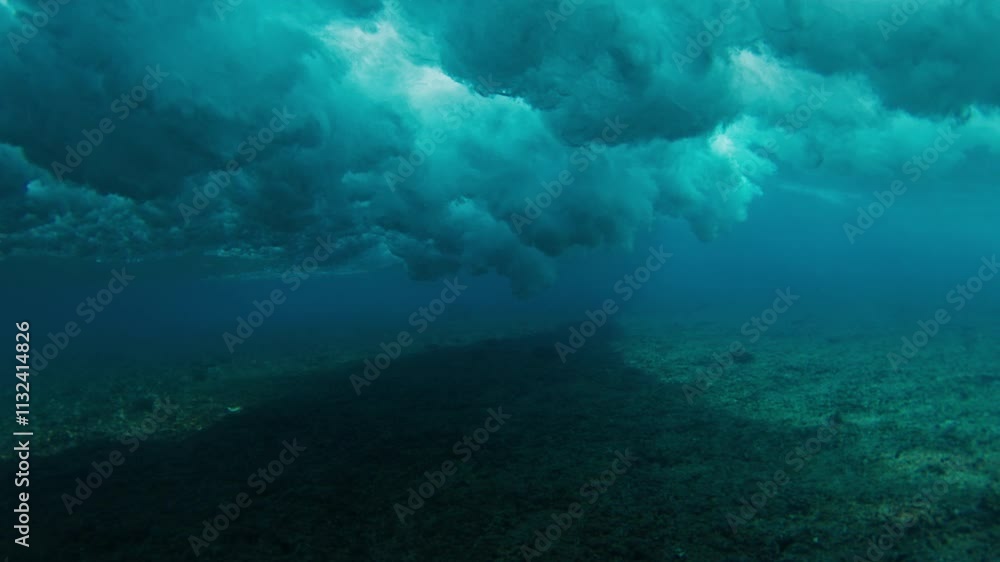 Poster Surfer is riding a wave with the scene from above and below the surface. Maldives