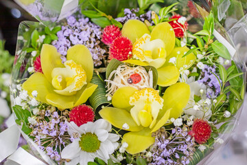 beautiful floral background with artificial ladybug. festive mood, spring
