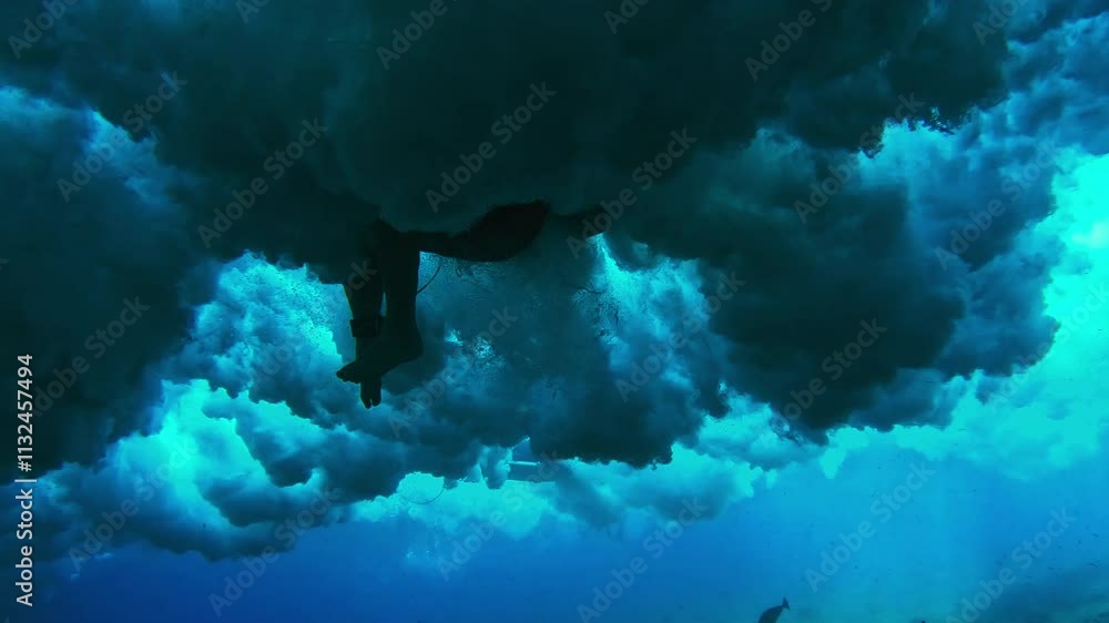 Aufkleber Underwater view of the wave breaking in the Maldives with surfer struggling in the water