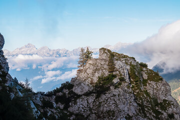 Rugged mountain peak Triglav in Julian Alps seen from rock formation of Begunjscica, Loibl Pass,...